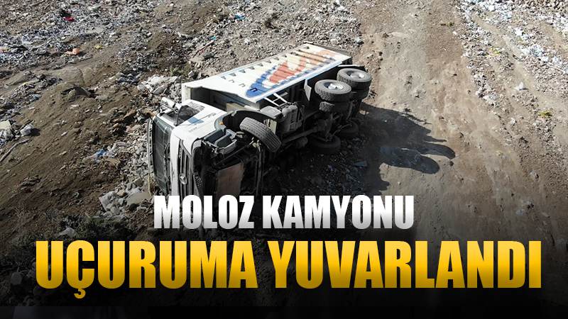 Molozları boşaltırken uçuruma yuvarlanan kamyonun sürücüsü ölümden döndü